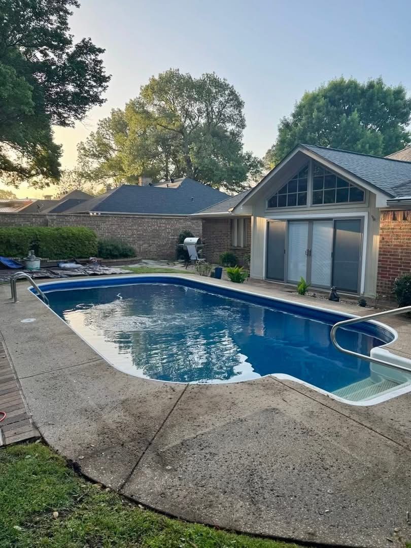 Worn concrete pool deck before diamond grinding and resurfacing