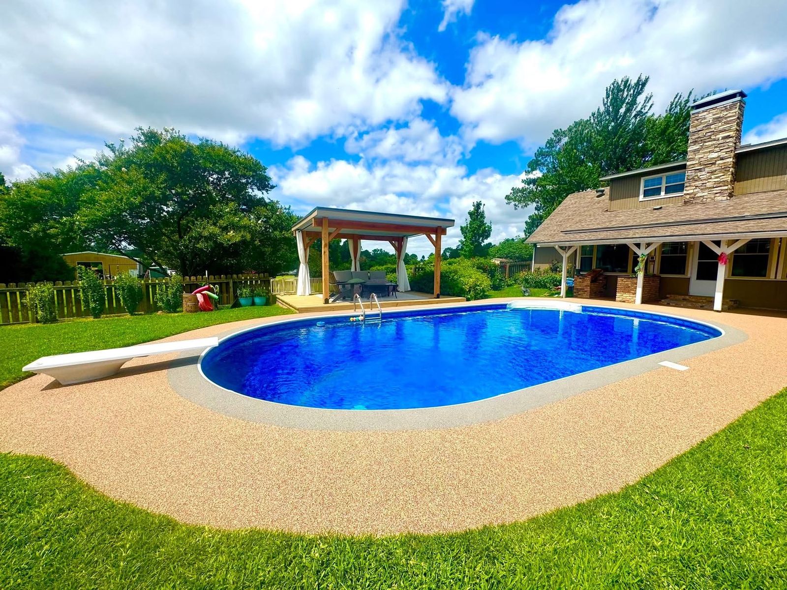 Finished tan speckled Pro-Flex deck surrounding a pool after grinding and resurfacing